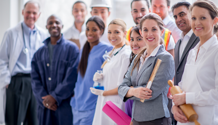 group of healthcare professionals standing in a group smiling