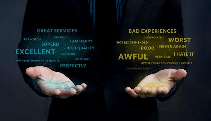 image of 2 hands on black background with one hand holding the positive words of great services, excellent, high quality, i am happy and the other hand holding yellow negative words like worst, bad experineces, awful, i hate it