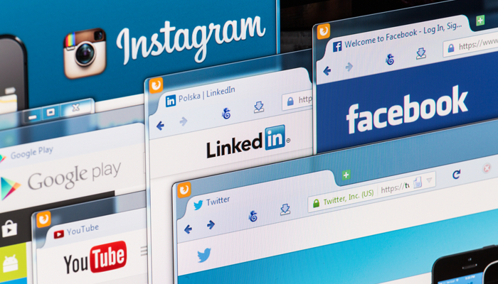 several open browsers showing social platforms like facebook, linkedin, youtube, instagram and google play indicating the importance of social media background checks