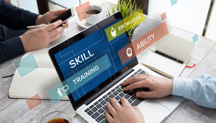 close up at laptop with words skill knowledge training and ability showcasing skills on demand