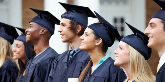 group of happy graduates in their cap and gown showcasing the best degrees for the future