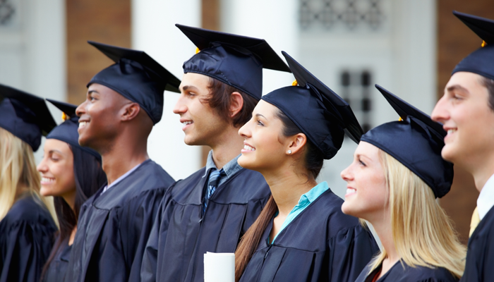 group of happy graduates in their cap and gown showcasing the best degrees for the future