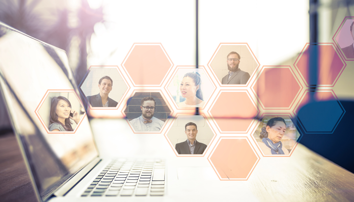 floating bubbles with faces in them coming from a laptop on a desk showcasing the technology recruitment and hiring top talent