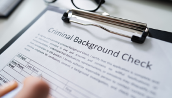 close up of criminal background check application on a clipboard