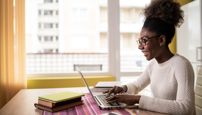 young black woman on laptop searching the best sites for jobs
