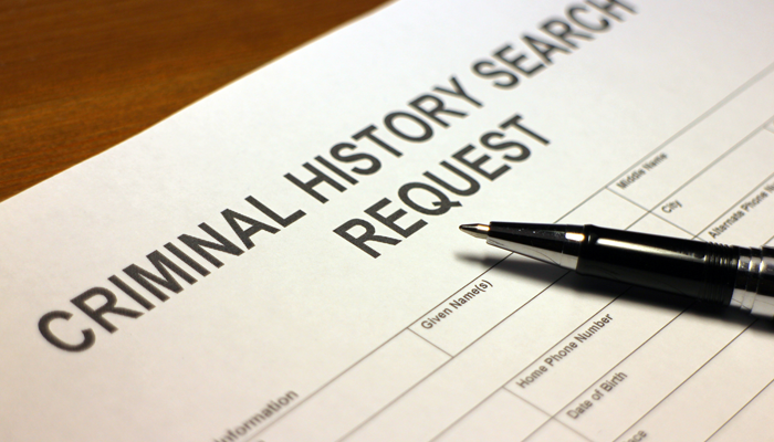 blank criminal history search request application with pen on the application showcasing background check protocols