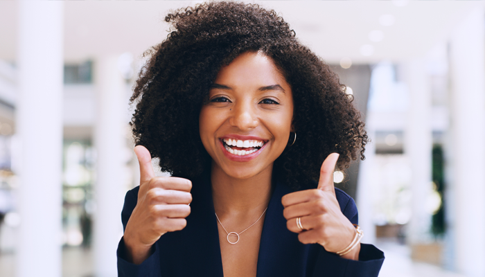 An image of an HR professional who is happy after taking advantage of a pre employment screening bundle.