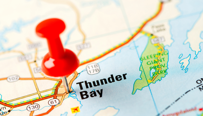 red push pin pinned to thunder bay on a map indicating thunder bay police record check