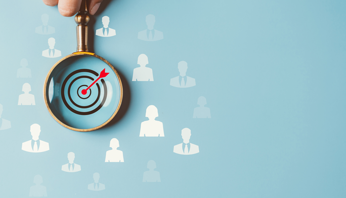 magnifying glass with bullseye in the center with blank people around it indicating the need for canadian criminal background checks